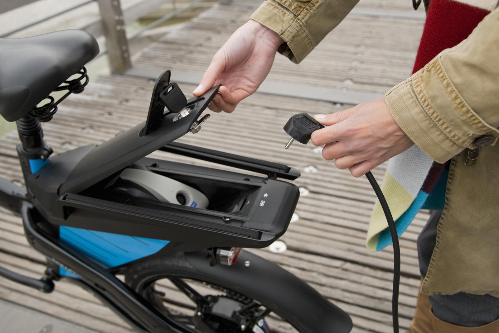 person charging an e-bike