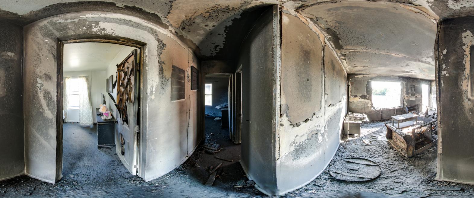 360 image of two bedrooms after a fire, one with the door open and one with the door closed