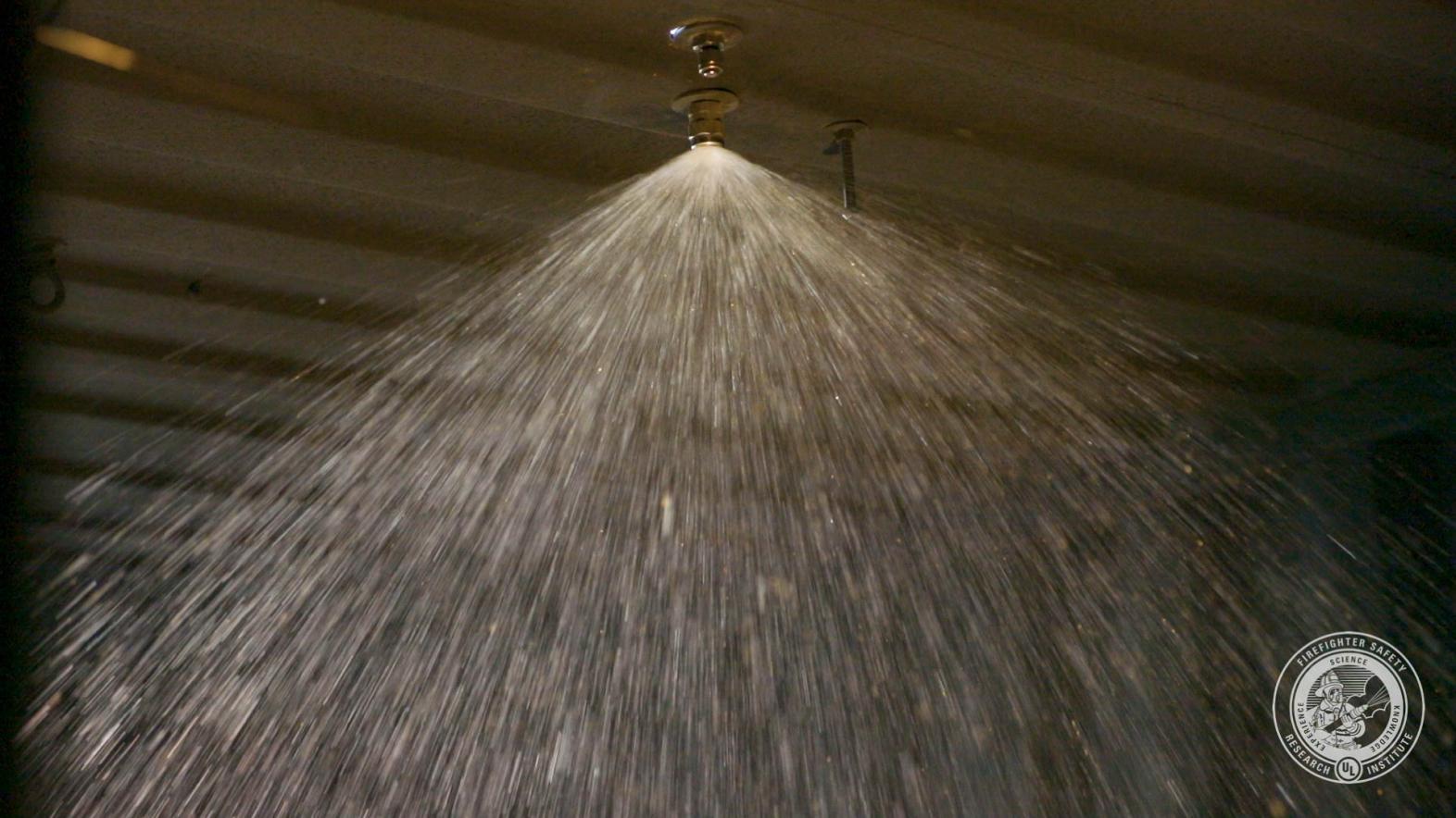 a spray nozzle flowing water at gpm