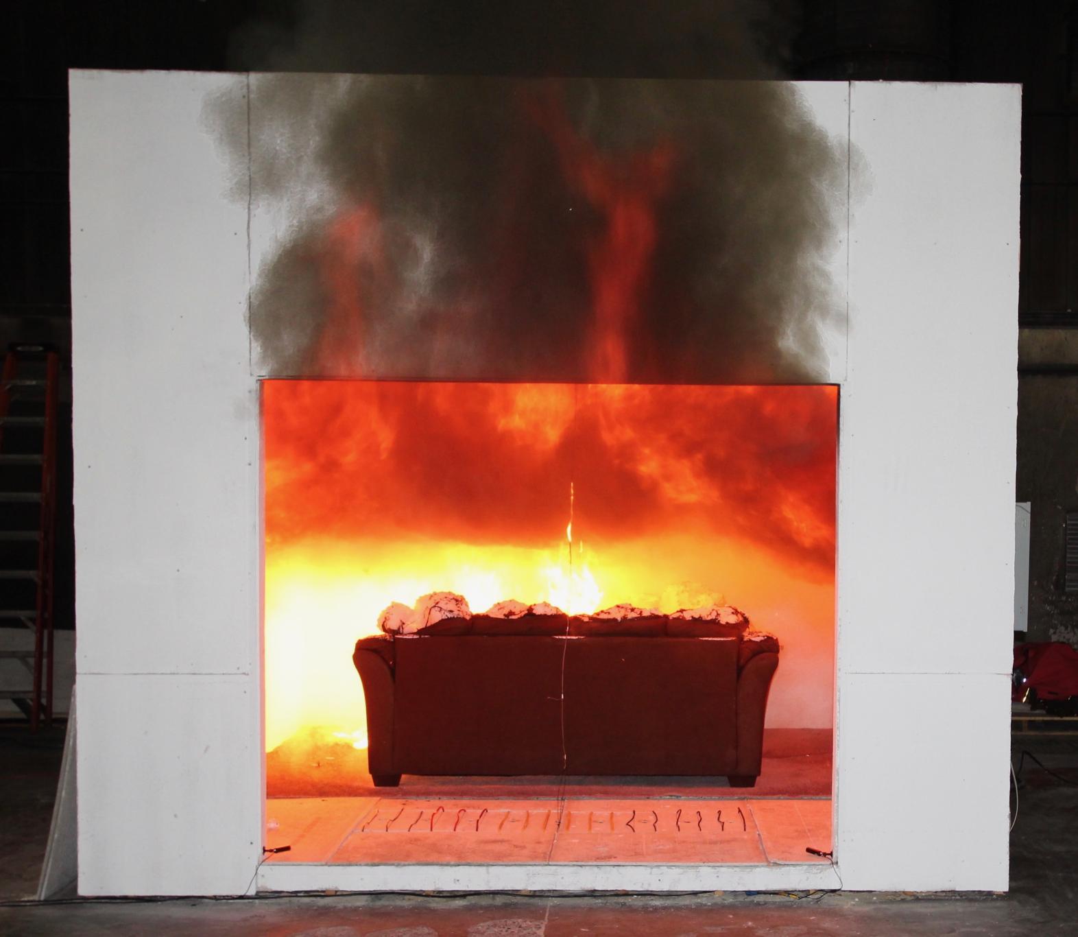 couch on fire within a compartment