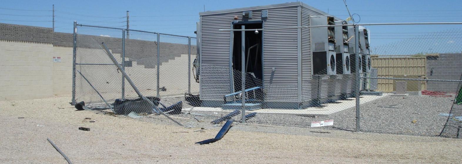 energy storage system with a broken fence and debris on the ground