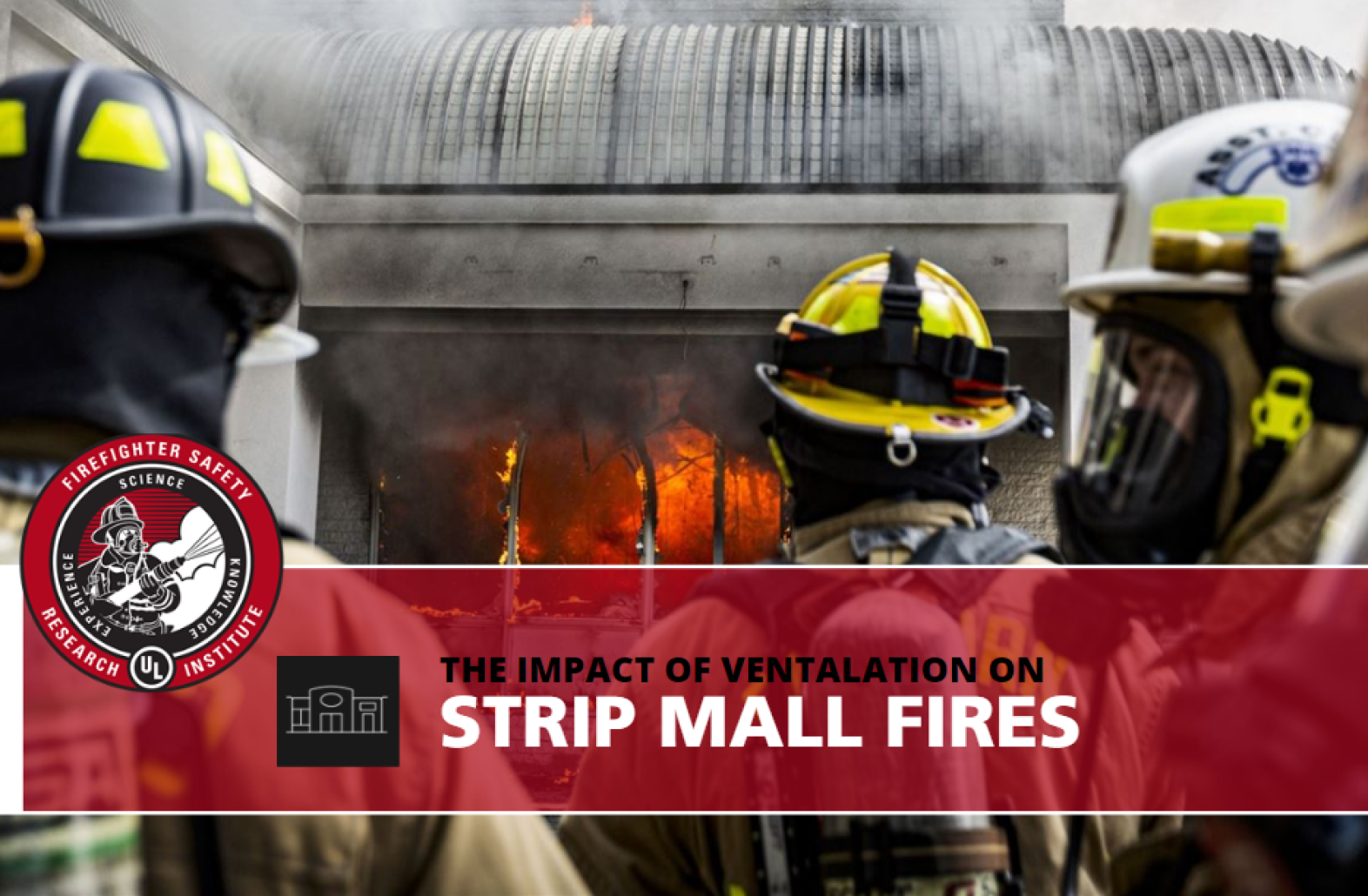 firefighters standing in front of a strip mall on fire