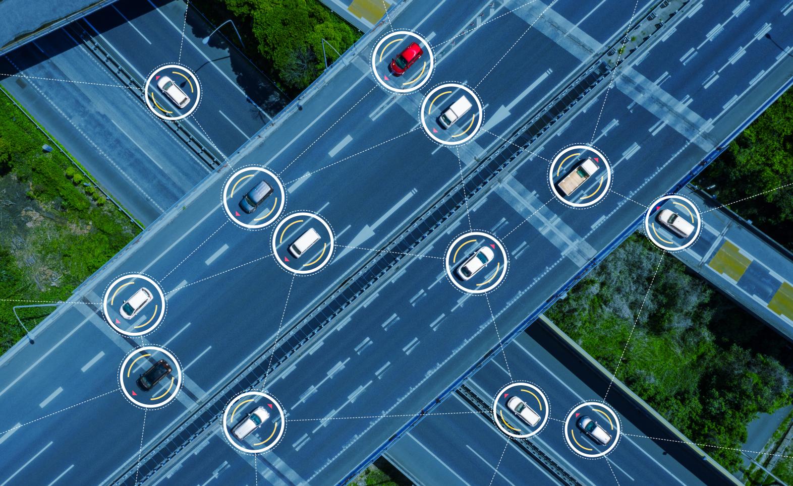 Overhead graphic design image of autonomous vehicles navigating a series of busy streets