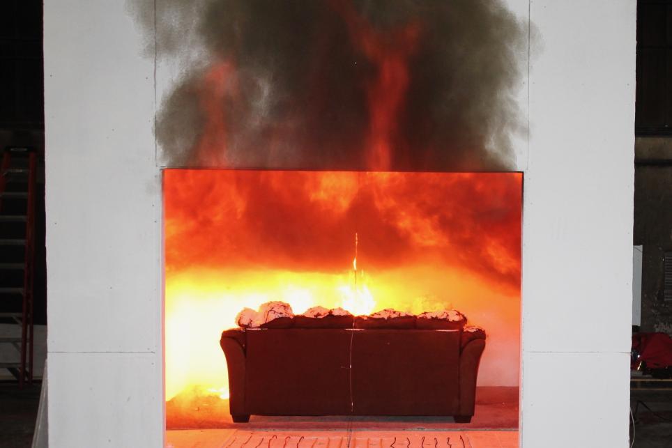 couch on fire within a compartment