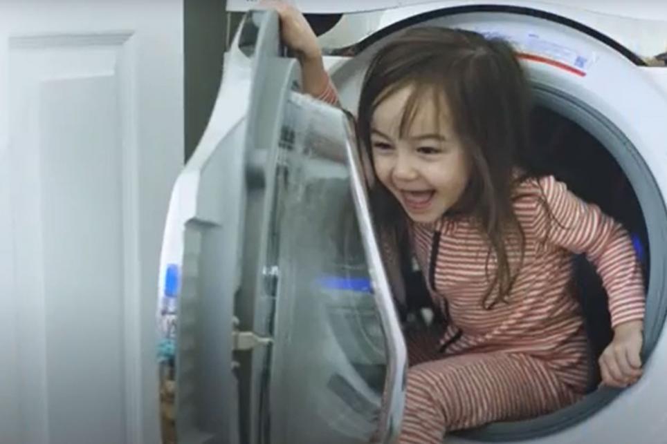 Child playing in dryer