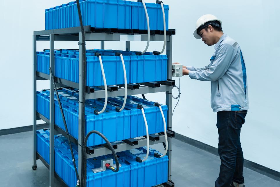 Engineer inspecting Battery Energy Storage System