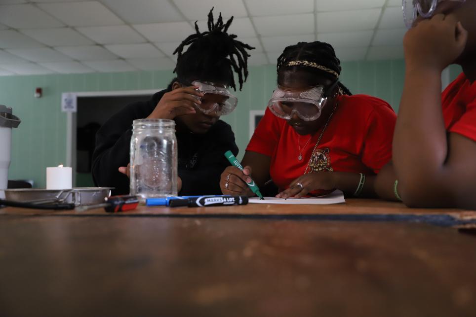 students doing science experiment