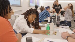 High school students engaging in a STEM experiment hosted by UL Research Institutes' Xplorlabs team