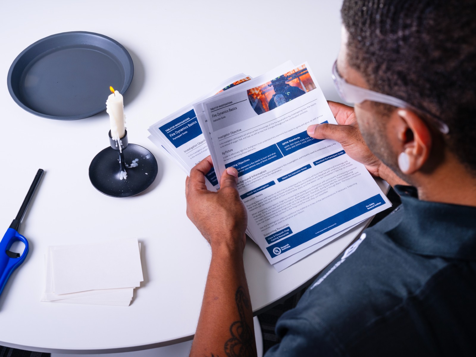 Training officer using one of the Hands-On Training Toolkits on the Resource Library on the Fire Safety Academy to improve firefighter training.