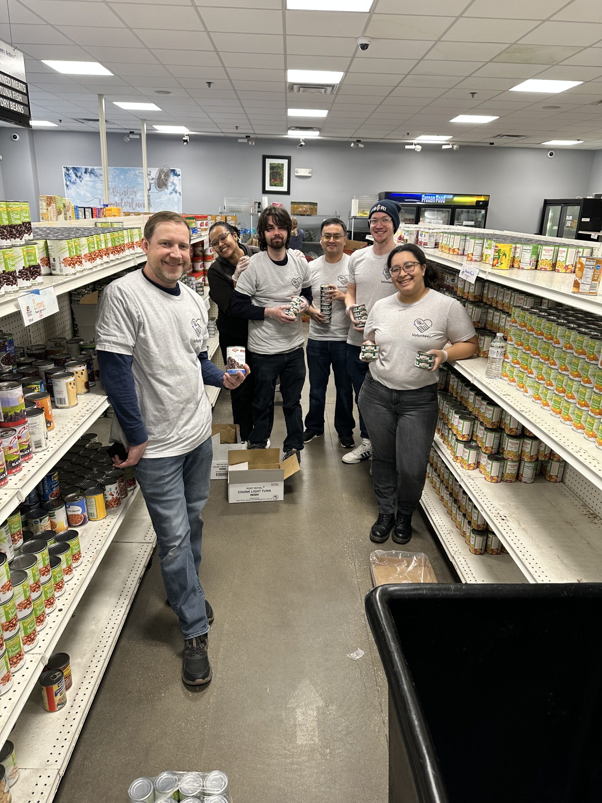 Employees of the Fire Safety Research Institute of UL Research Institutes gather to sort food donations at the Howard County Food Bank