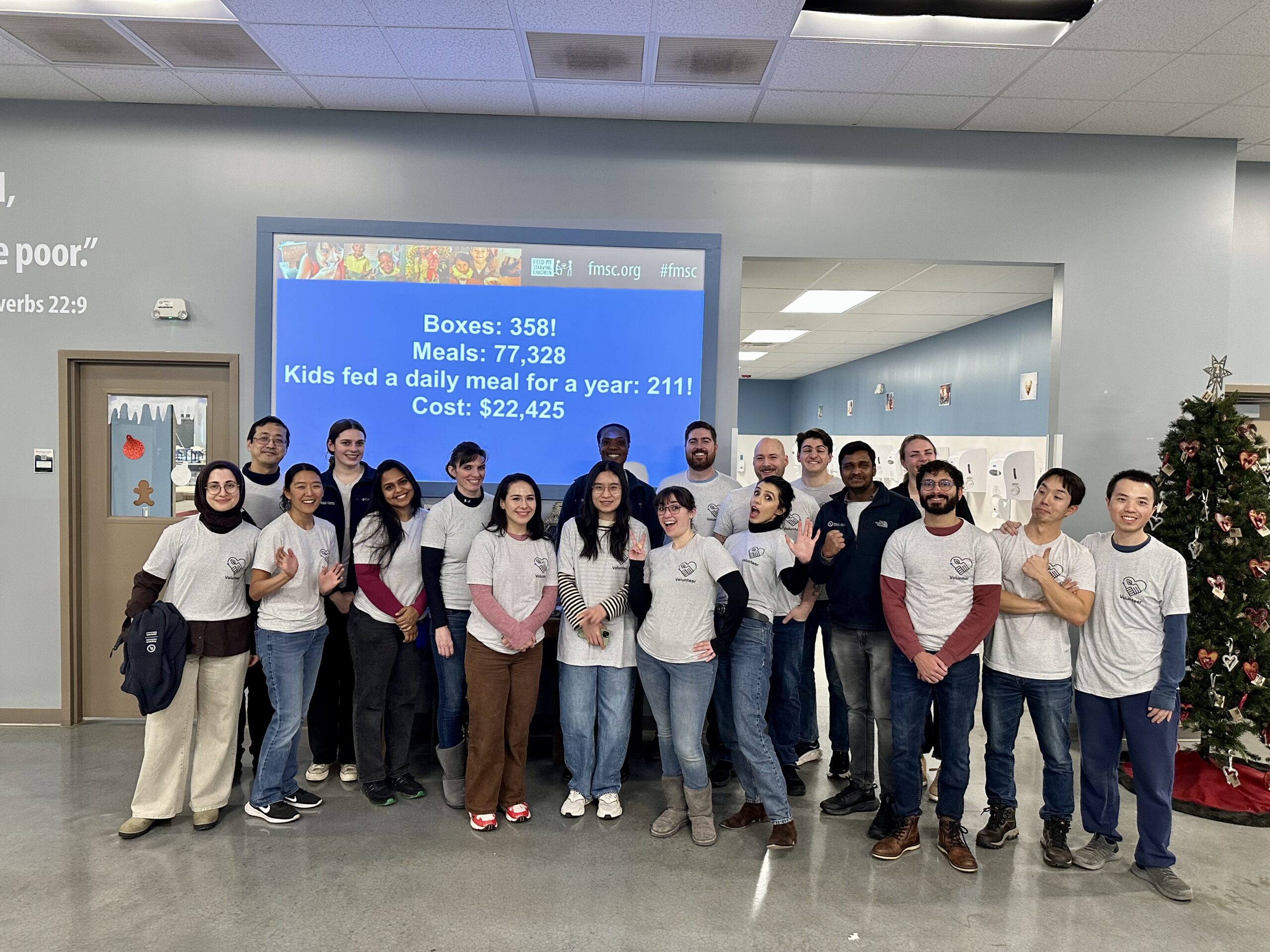Employees of the Materials Discovery Research Institute of UL Research Institutes gather in a group after packing 130,000 meals for Feed My Starving Children in Schaumburg, IL.