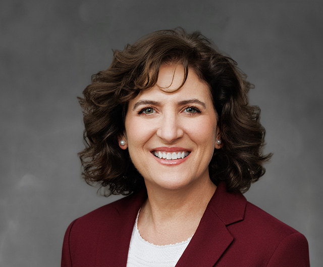 Isabelle Garcia professional headshot against gray background