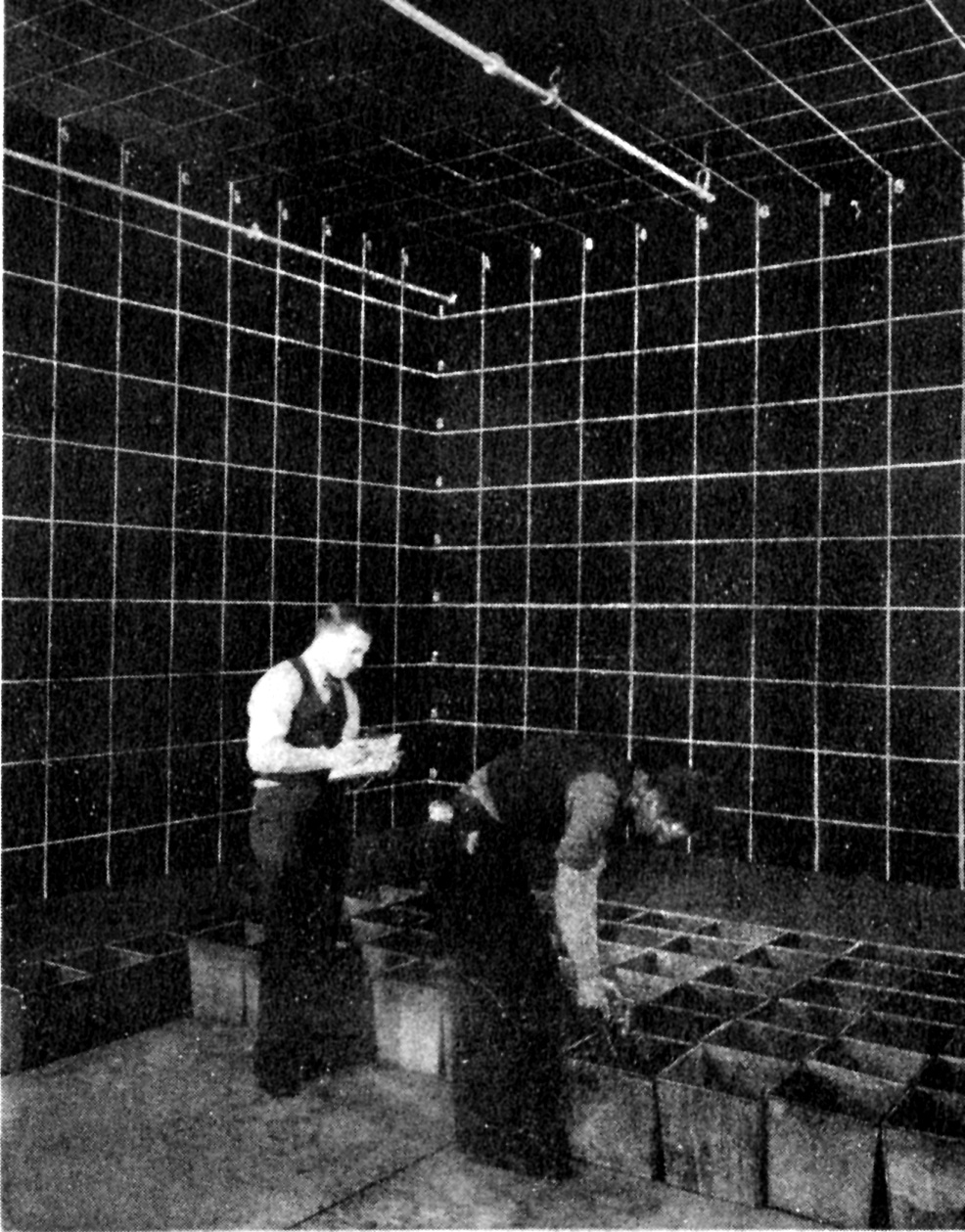 Armour students at Underwriters Laboratories measuring water distributed by automatic sprinklers. UL Archives.