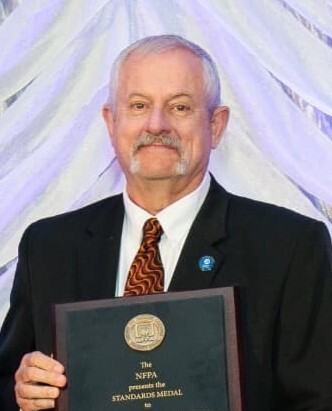 Madrzykowski receiving the 2026 National Fire Protection Association Standards Medal.